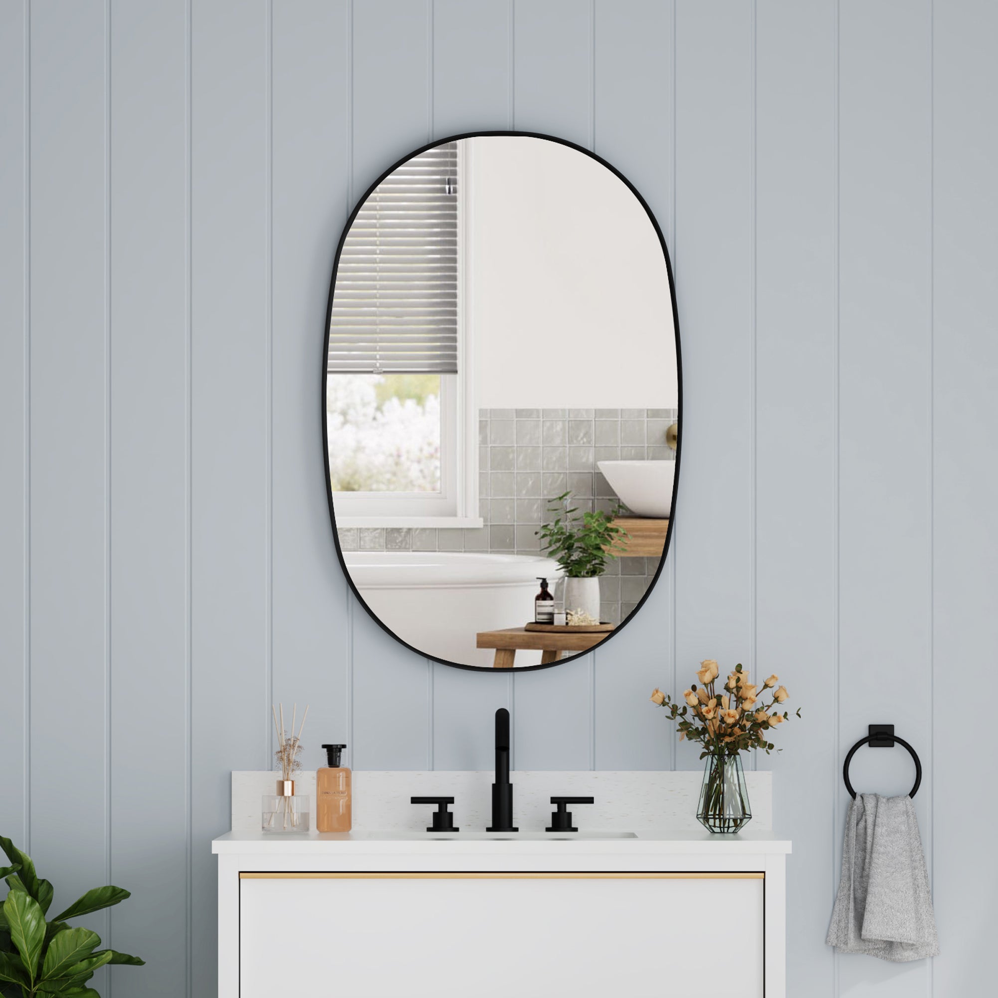 24 in. W. x 36 in. H Oval Framed Wall Bathroom Vanity Mirror in Matte Black